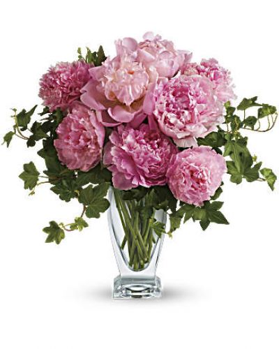 <p>Peony perfection! Everyone loves the lush, cloud-like appearance of fresh cut peonies. The romantic, feminine bloom is a popular summer wedding flower. In fact, many brides select their June or July wedding dates based on the cut peony flower season! This simple bouquet is a beautiful pick for any pink-lover. Also, a luxurious wedding centerpiece!<br />
Freshly cut pink peonies and classic green ivy are gathered elegantly into a glass vase</p>