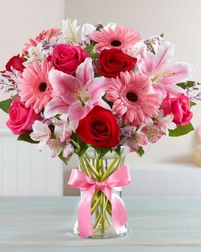<p>Inspired by the rich beauty of the European countryside, our romantic bouquet reveals all the feelings you have in your heart. Fresh-picked pink & red blooms are on display inside a glass vase finished with ribbon, creating a timeless gift for someone you love.</p>