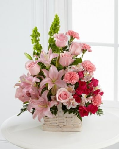 <p>The FTD® Beautiful Spirit™ Arrangement is a light and lovely way to honor the life of the deceased. A blushing display of pink roses, Asiatic lilies and Peruvian lilies are highlighted by stems of fuchsia carnations and spray roses as well as Bells of Ireland and assorted lush greens. Seated in a white woodchip basket, this graceful arrangement creates an exceptional way to offer peace and sympathy.</p>